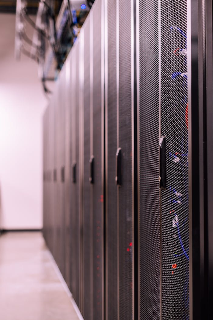 about-01 Row of similar lockers with various optic fiber cables in modern data server room